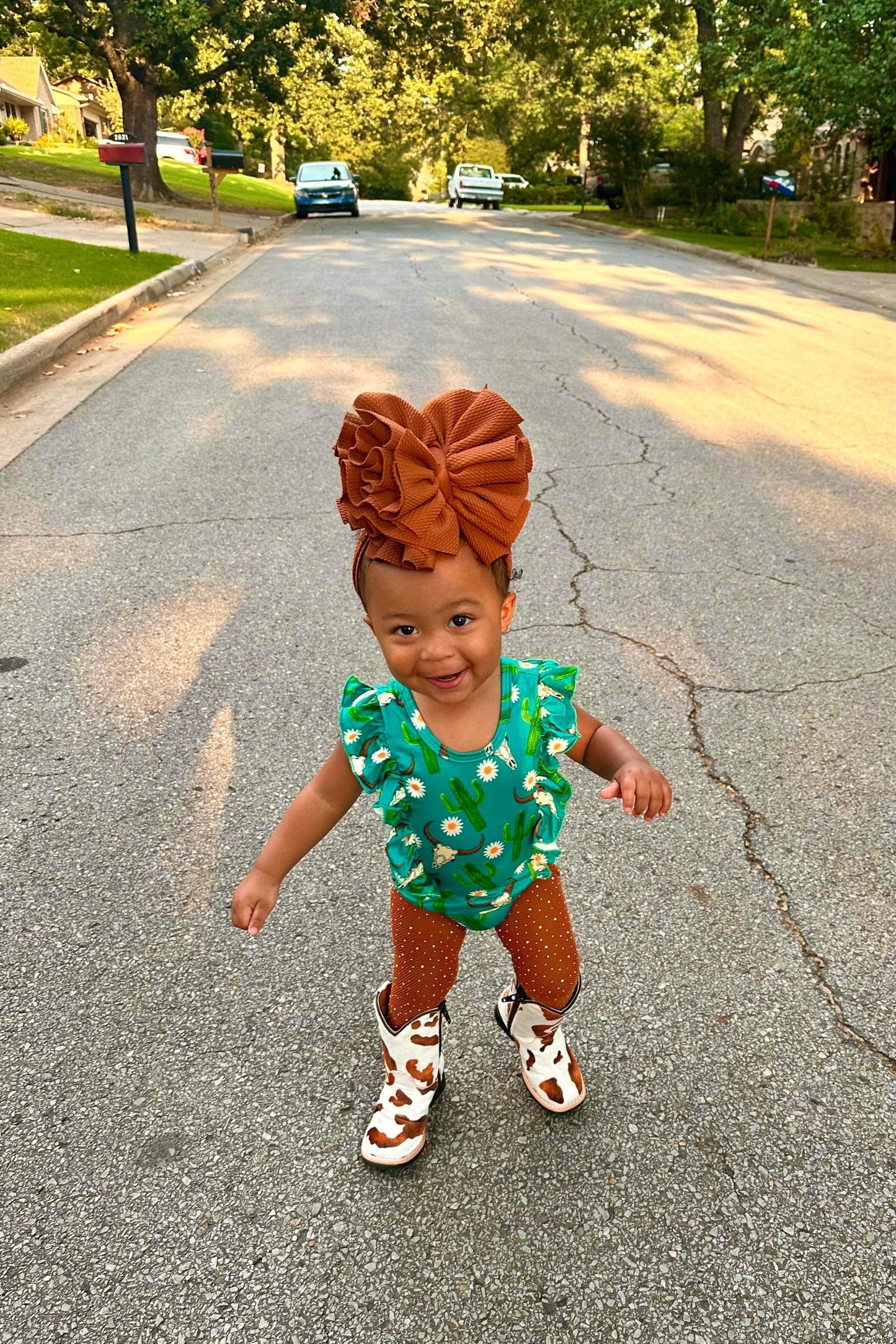 Brown & White Cow Print Tanner Mark Boots