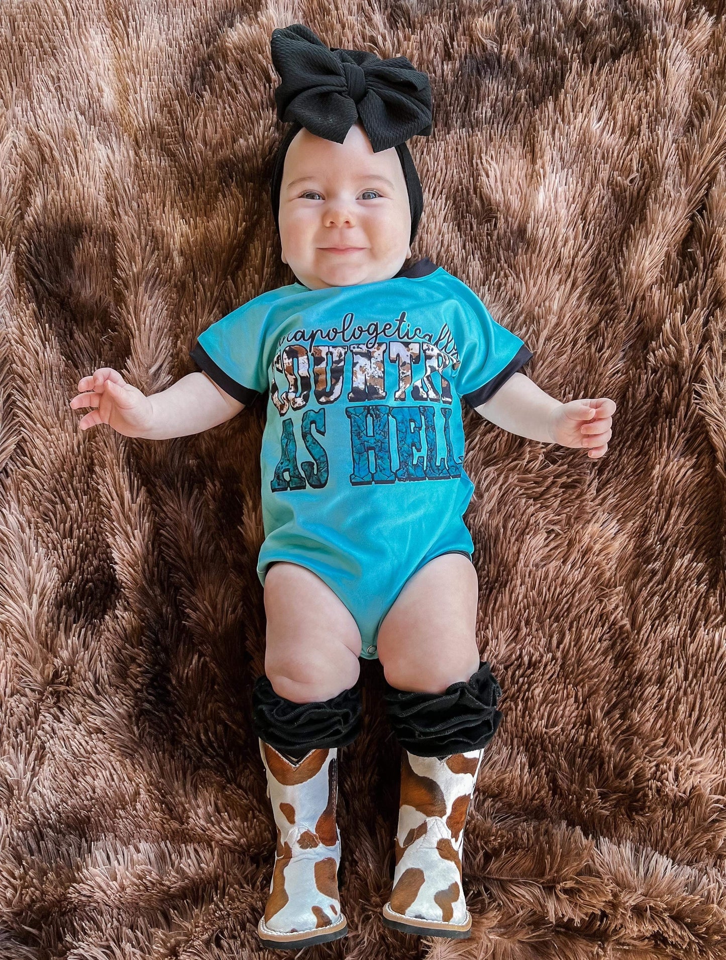 Brown & White Cow Print Tanner Mark Boots